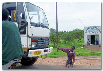 Disabled man crossing the road without a wheelchair