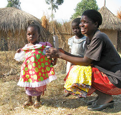 Girl Receives New Dress- Happy Mom