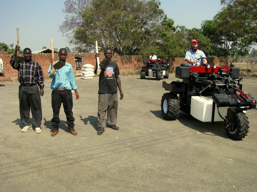 V-Tractor and Men with Garden Hoes