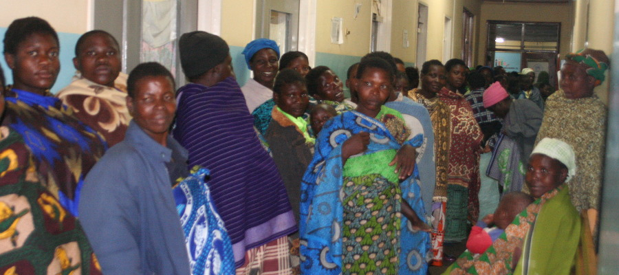 Pregnant Women wait in line an for care