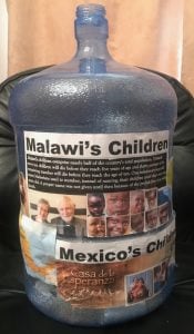 Water jug used for collecting donations