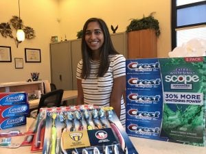 Beautiful Smile with toothpaste and toothbrushes in the foreground