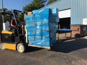 A forklift carrying medical supplies