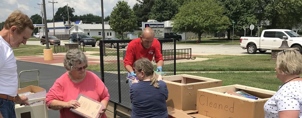 Volunteers loading books for Boone County's Central Elementary book donation