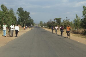 People walking on either side of the narrow road