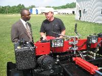 Mr Ajiboye of the African Center learns what the V-Tractor can do.